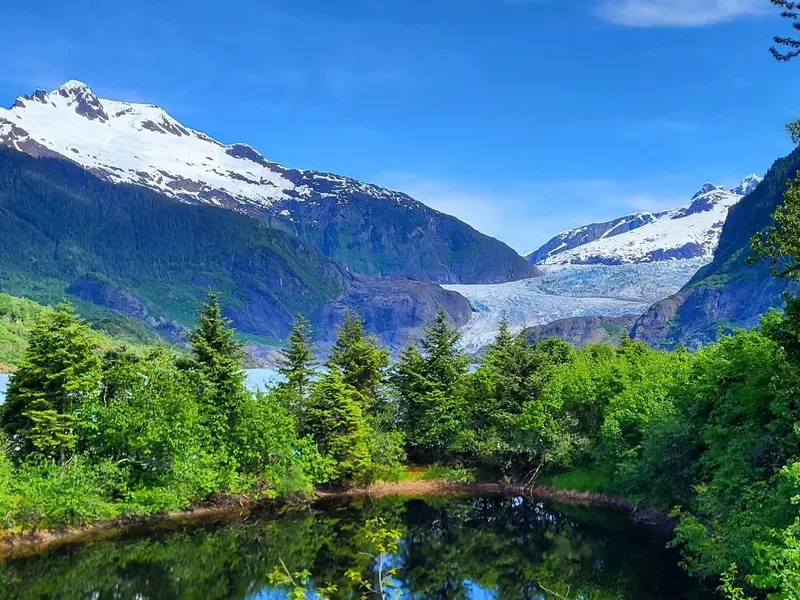 Sightseeing trolley parked near the visitor center on a Mendenhall Glacier trolley tour from the Juneau cruise dock
