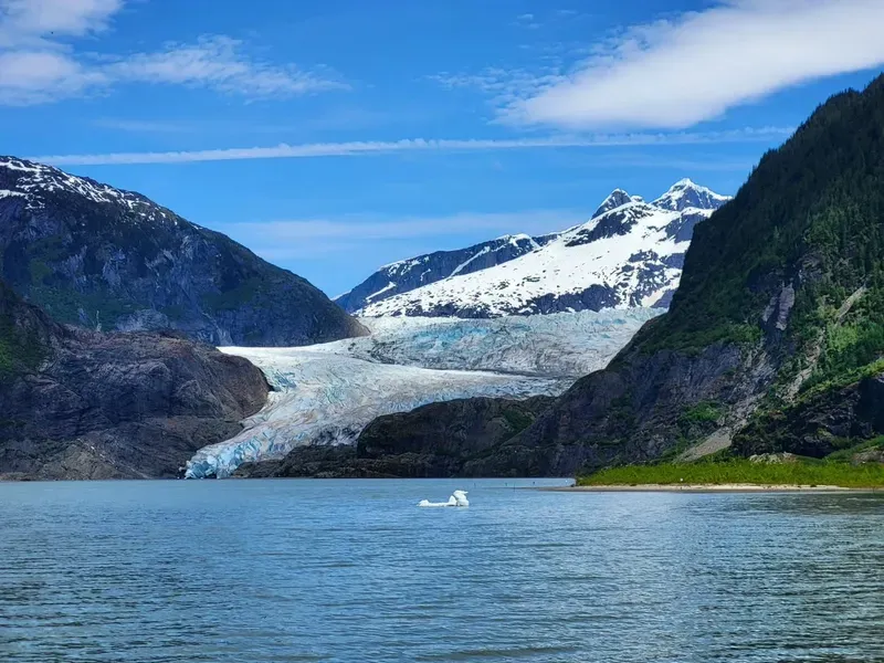 Blue shuttle bus dropping visitors at the recreation area on a Mendenhall Glacier express tour from the Juneau cruise terminal
