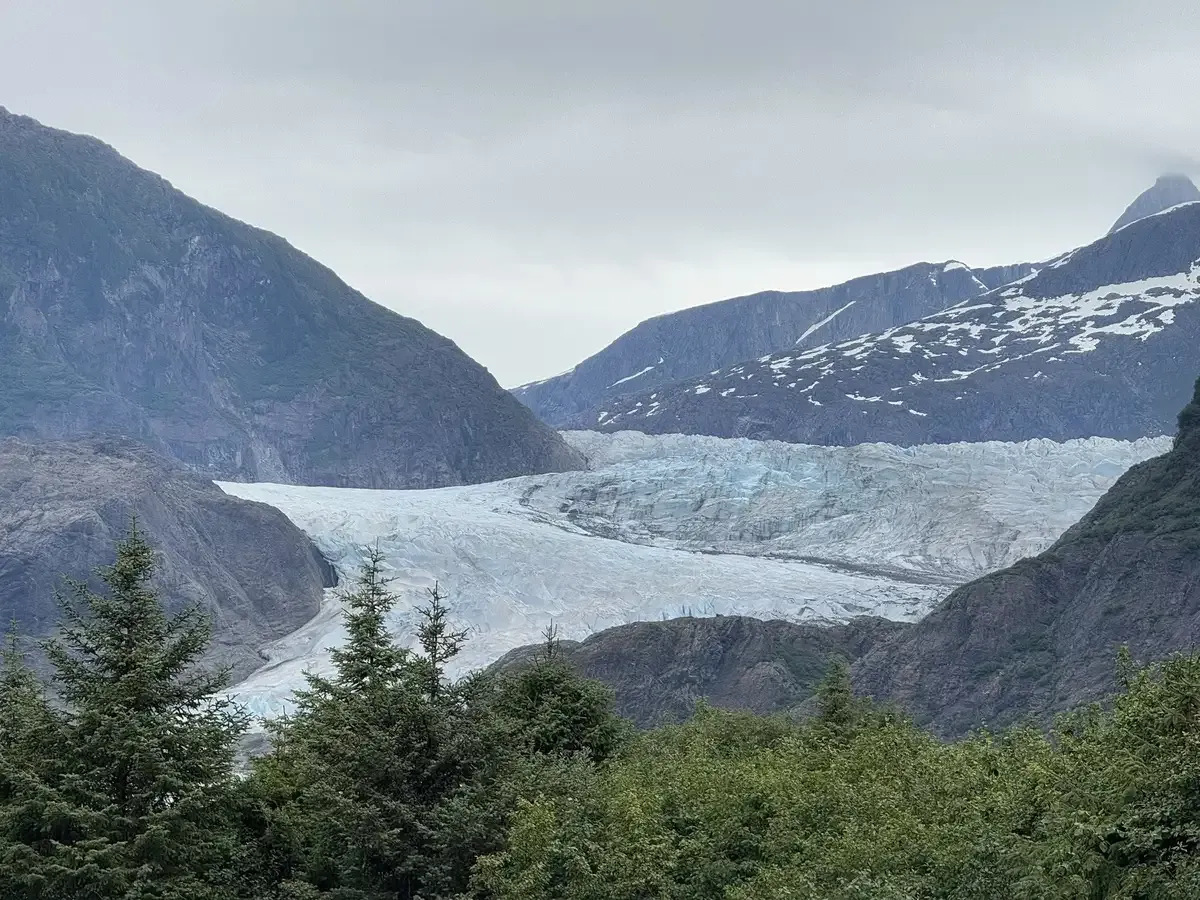 Mendenhall Glacier face across Mendenhall Lake from Photo Point during the most reviewed Juneau glacier and whale watching tour stop